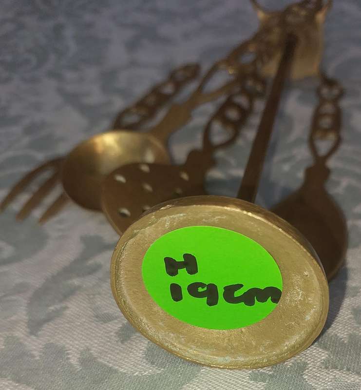 AN ART DECOR BRASS STAND WITH CUTLERY SOLD AS IS
