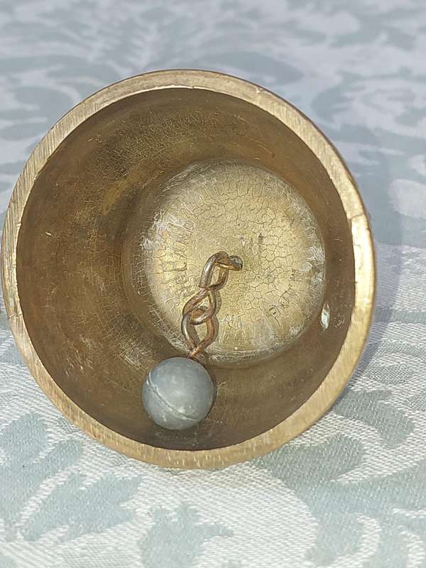 A VINTAGE BRASS VASE AND A BELL SOLD AS IS