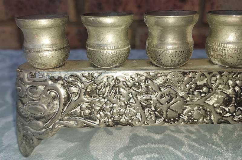 A VINTAGE ISRAEL JUDAICA MENORA SOLD AS IS
