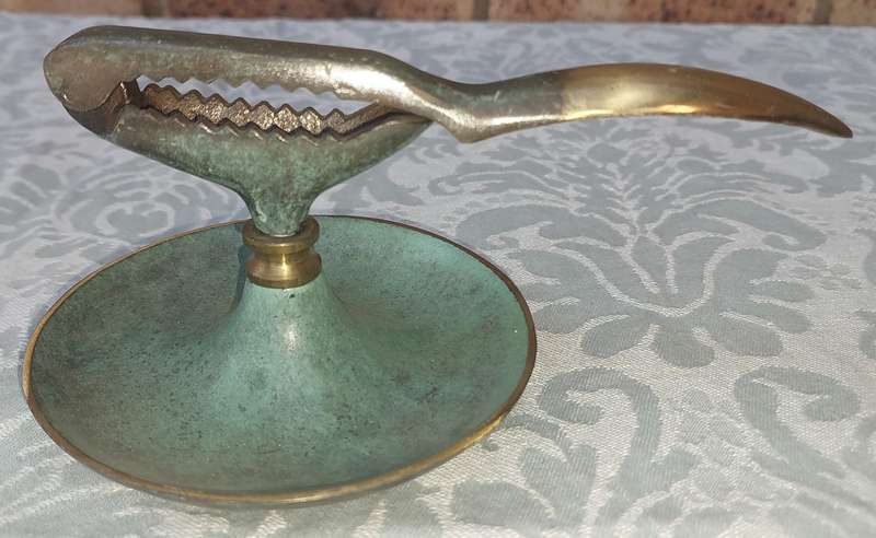 A VINTAGE ART DECOR MADE IN ISRAEL BRASS WITH GREEN TINT NUT CRACKER SOLD AS IS