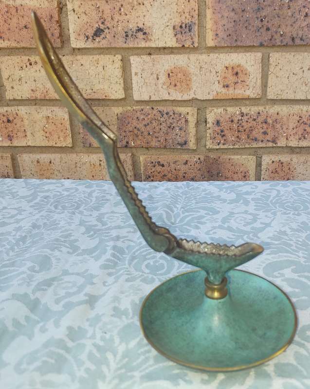 A VINTAGE ART DECOR MADE IN ISRAEL BRASS WITH GREEN TINT NUT CRACKER SOLD AS IS