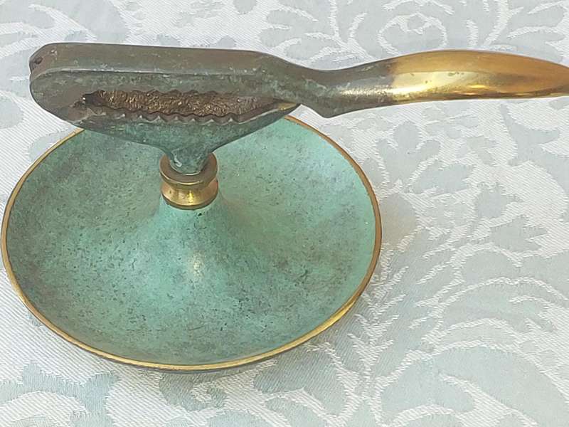 A VINTAGE ART DECOR MADE IN ISRAEL BRASS WITH GREEN TINT NUT CRACKER SOLD AS IS
