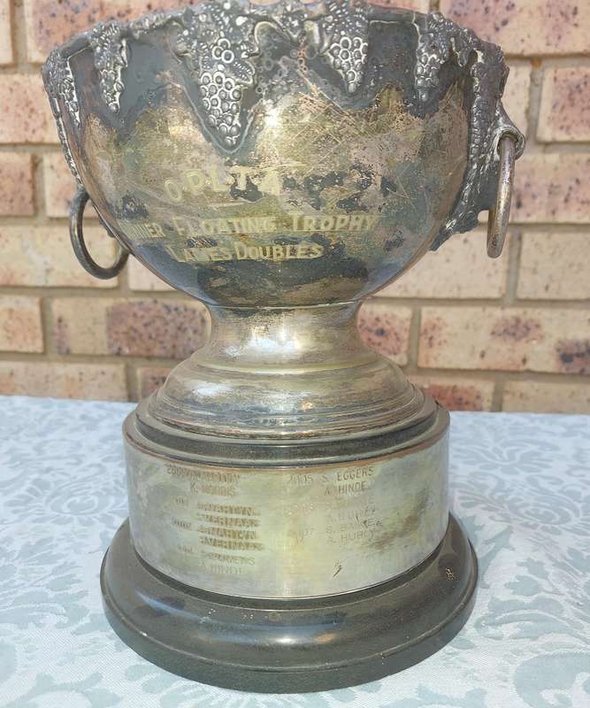 A large vintage floating trophy tennis winners sold s is