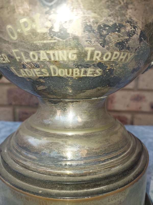 A large vintage floating trophy tennis winners sold s is