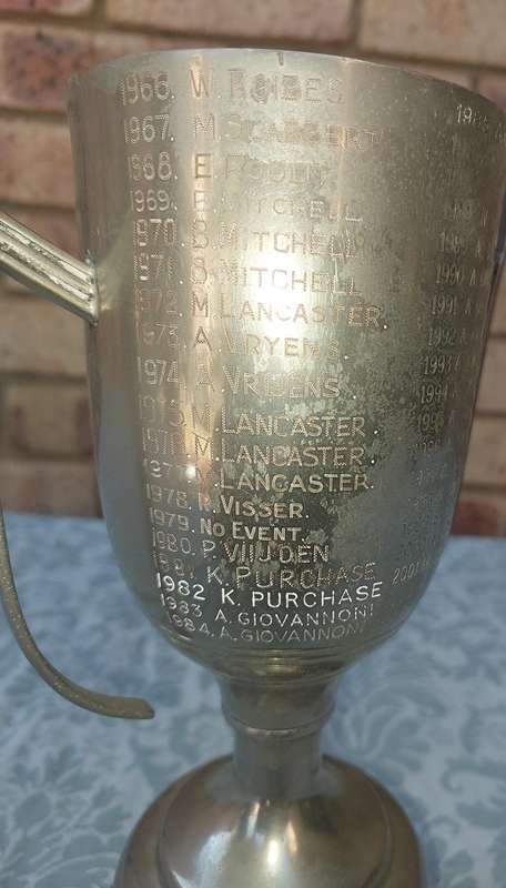 A VINTAGE TENNIS CHAMPIONS FLAOTING TROPHY SOLD AS IS