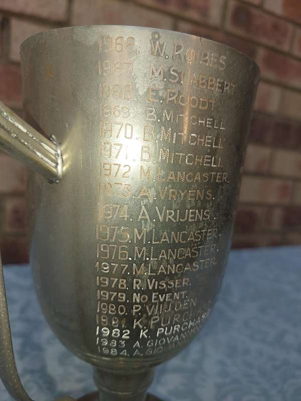 A VINTAGE TENNIS CHAMPIONS FLAOTING TROPHY SOLD AS IS