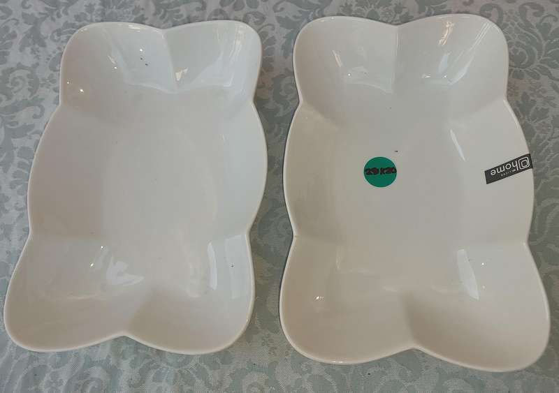 A PAIR OF PORCELAIN FLOWER SHAPED PLATTERS SOLD AS IS