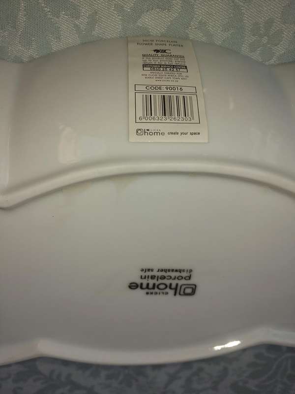 A PAIR OF PORCELAIN FLOWER SHAPED PLATTERS SOLD AS IS