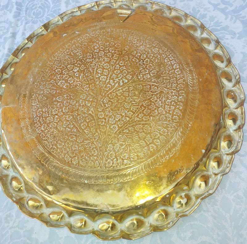 AN ART DECOR BRASS HAMMERED MORROCAN STYLE WALL PLAQUE SOLD AS IS