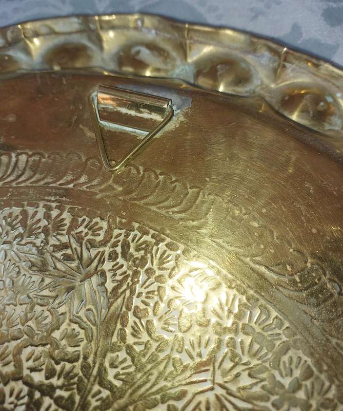 AN ART DECOR BRASS HAMMERED MORROCAN STYLE WALL PLAQUE SOLD AS IS