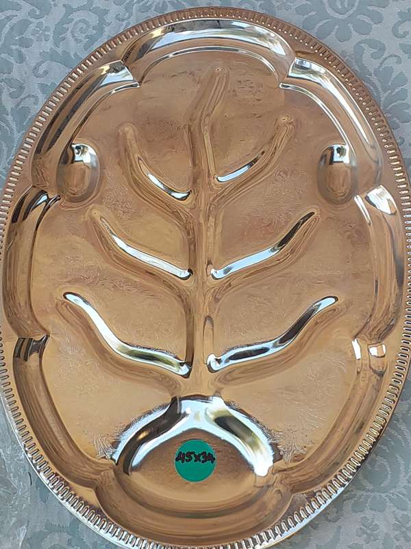 AN ART DECOR TARNISH PROOF CARVING PLATTER SOLD AS IS
