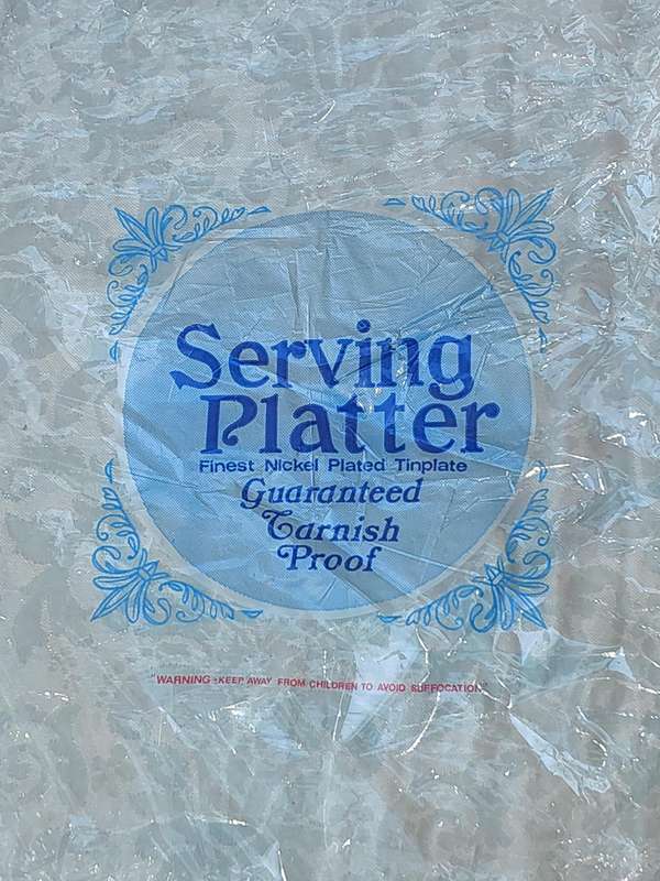 AN ART DECOR TARNISH PROOF CARVING PLATTER SOLD AS IS