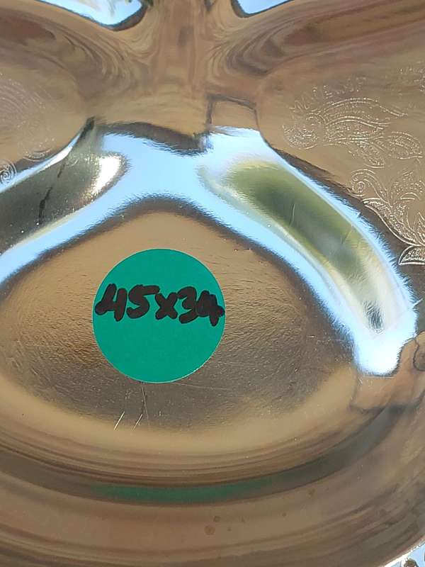 AN ART DECOR TARNISH PROOF CARVING PLATTER SOLD AS IS
