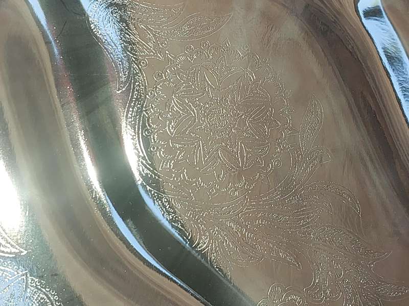 AN ART DECOR TARNISH PROOF CARVING PLATTER SOLD AS IS