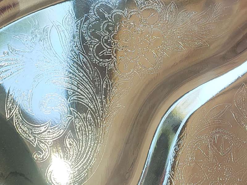 AN ART DECOR TARNISH PROOF CARVING PLATTER SOLD AS IS