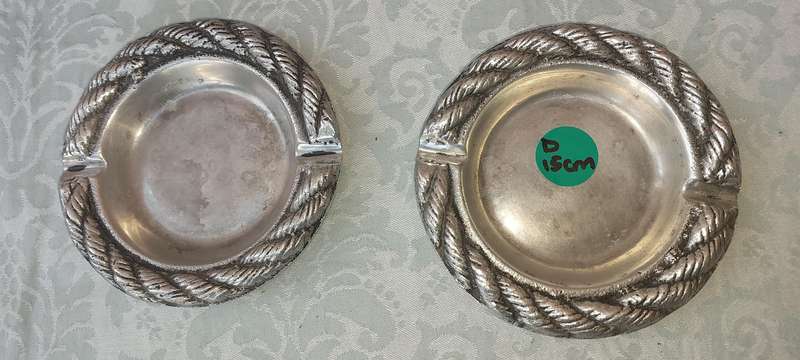 A PAIR OF PEWTER ART DECOR ASH TRAYS SOLD AS IS