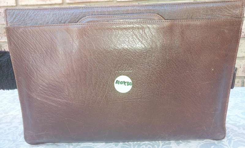 A GENUINE LEATHER EXECUTIVE BRIEFCASE BURGUNDY BROWN MADE IN ARGENTINA SOLD AS IS