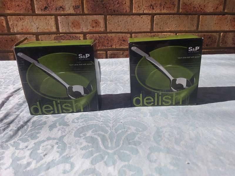 TWO DELISH S A & P OLIVE DISHES WITH SPOONS SOLD AS IS