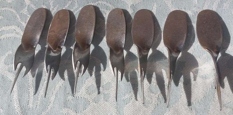 A COLLECTION STAINLESS STEEL CORN ON THE COB HOLDERS SOLD AS IS