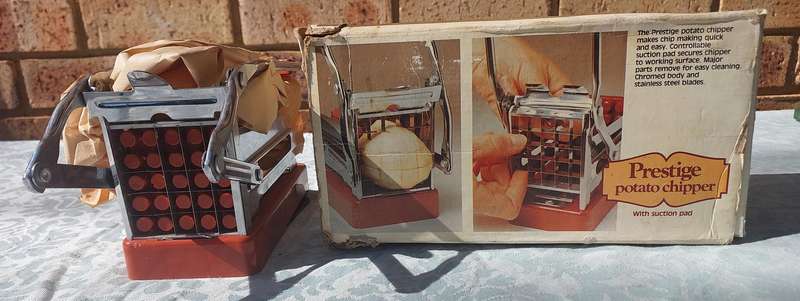A VINTAGE COMPLETE PRESTEGE PATATOE CHOPPER SOLD AS IS