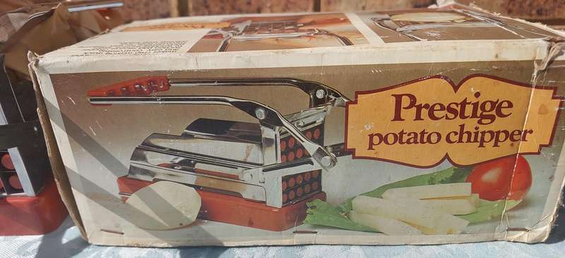 A VINTAGE COMPLETE PRESTEGE PATATOE CHOPPER SOLD AS IS