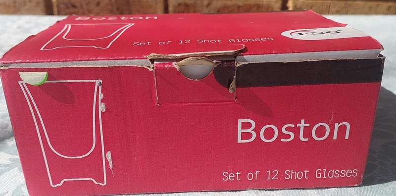 A SET OF 12 BOSTON SHOT GLASSES SOLD AS IS