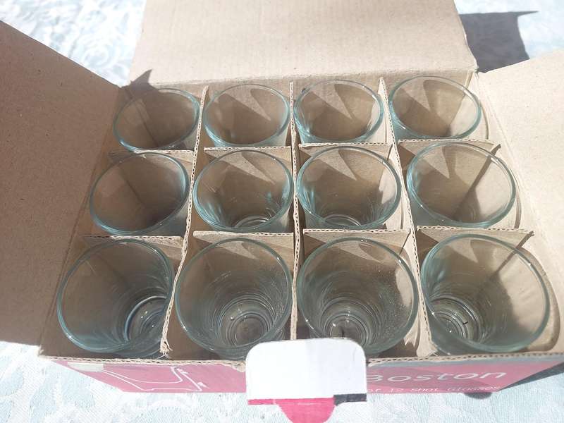 A SET OF 12 BOSTON SHOT GLASSES SOLD AS IS