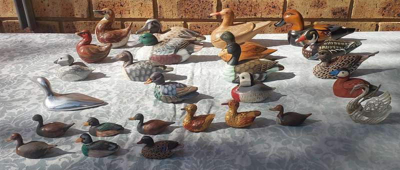AN ENTIRE COLLECTION DUCK DECOYS AND FIGURINES SOLD AS IS