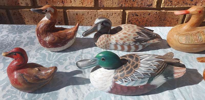 AN ENTIRE COLLECTION DUCK DECOYS AND FIGURINES SOLD AS IS