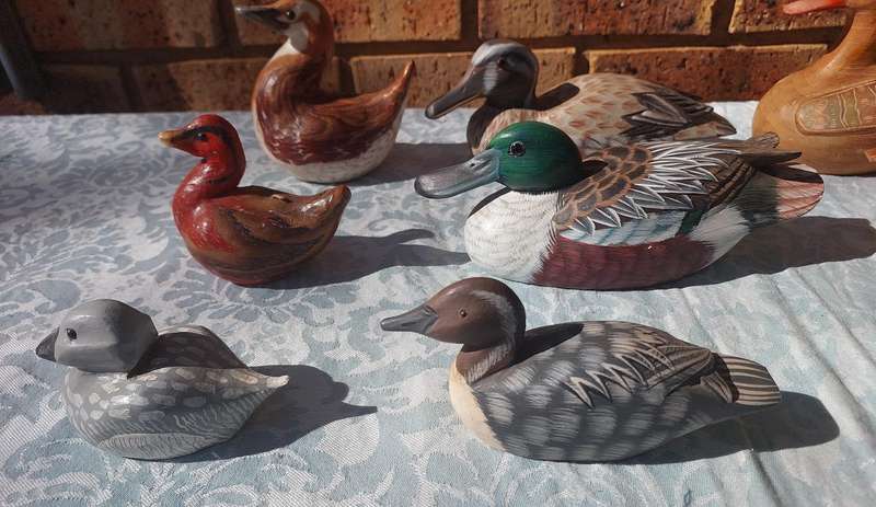 AN ENTIRE COLLECTION DUCK DECOYS AND FIGURINES SOLD AS IS