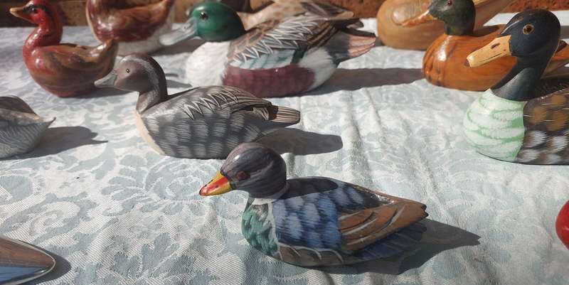 AN ENTIRE COLLECTION DUCK DECOYS AND FIGURINES SOLD AS IS