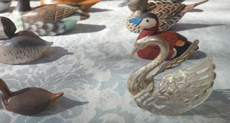 AN ENTIRE COLLECTION DUCK DECOYS AND FIGURINES SOLD AS IS