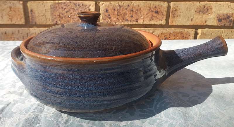 A CERAMIC GLASED BAKED SOUP TUREEN SOLD AS IS