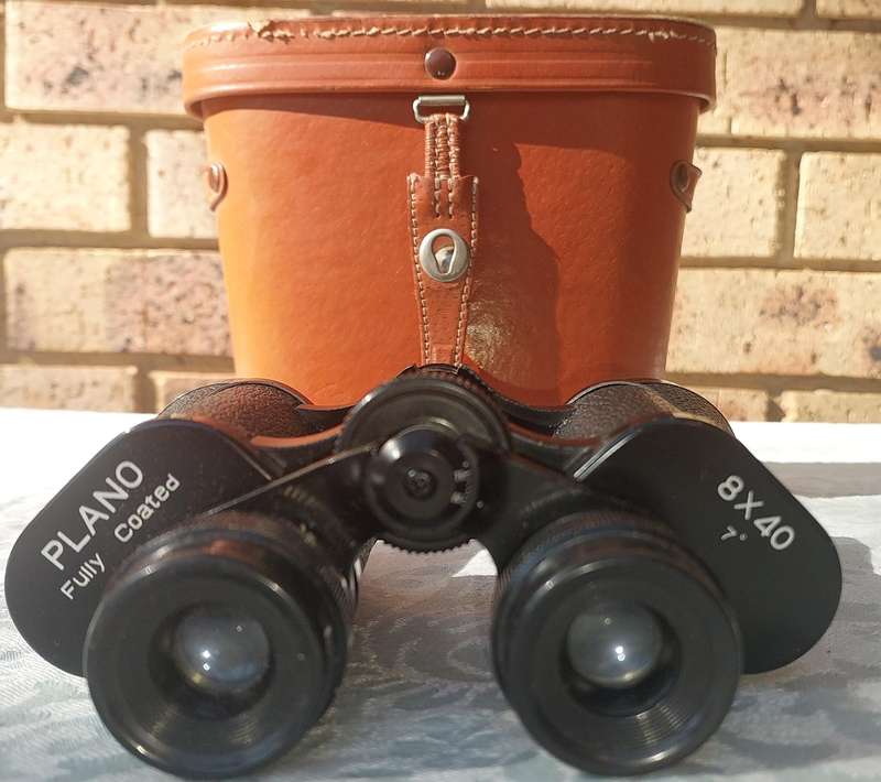 A vintage plano 8x40 binoculars sold as is