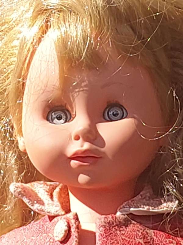 A VINTAGE DOLL SOLD AS IS