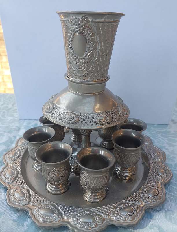 A VINTAGE SILVERPLATED KIDDUSH SET SOLD AS IS