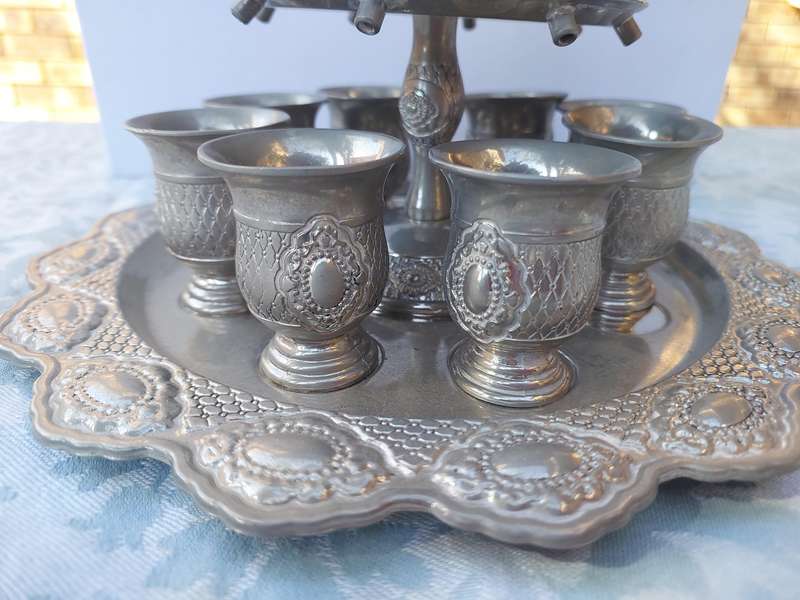 A VINTAGE SILVERPLATED KIDDUSH SET SOLD AS IS
