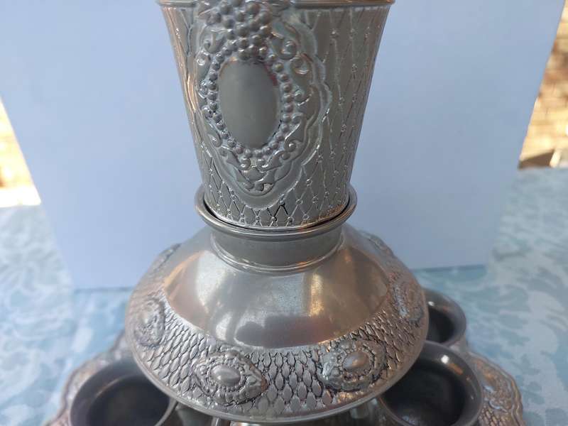 A VINTAGE SILVERPLATED KIDDUSH SET SOLD AS IS