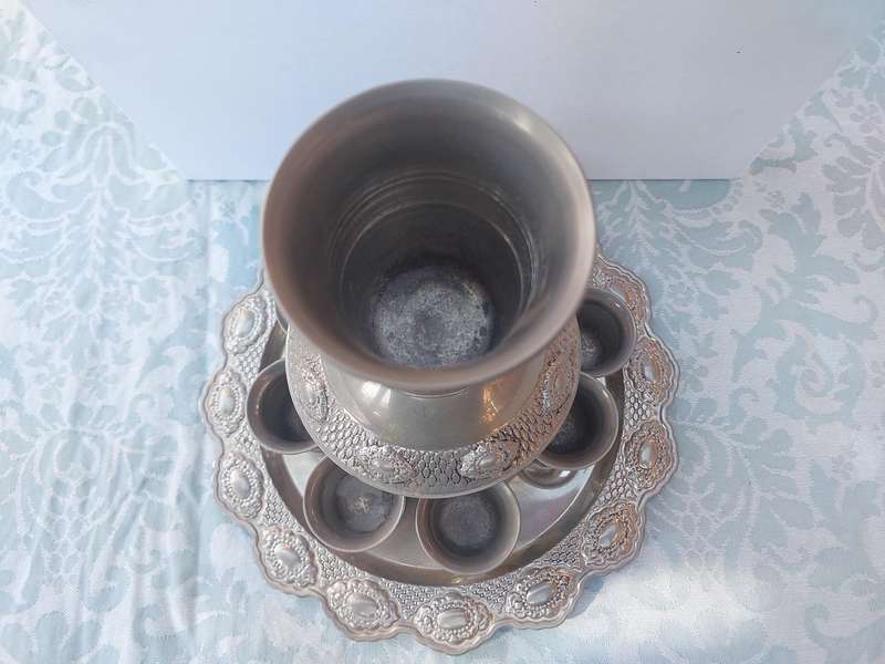 A VINTAGE SILVERPLATED KIDDUSH SET SOLD AS IS