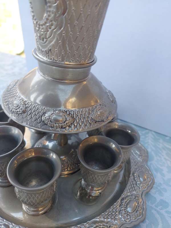 A VINTAGE SILVERPLATED KIDDUSH SET SOLD AS IS