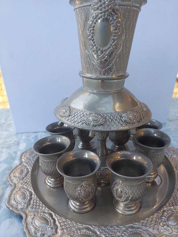 A VINTAGE SILVERPLATED KIDDUSH SET SOLD AS IS