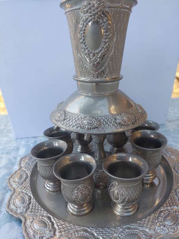 A VINTAGE SILVERPLATED KIDDUSH SET SOLD AS IS