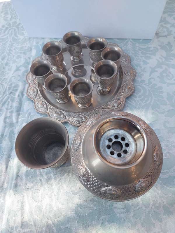 A VINTAGE SILVERPLATED KIDDUSH SET SOLD AS IS