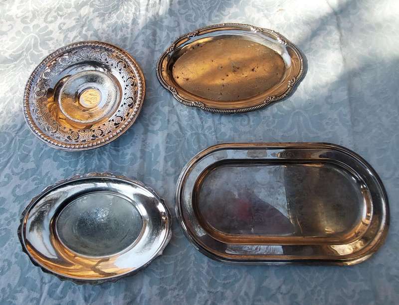 A COLLECTION OF SILVER PLATED SERVING TRAYS SOLD AS IS