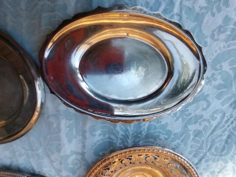 A COLLECTION OF SILVER PLATED SERVING TRAYS SOLD AS IS