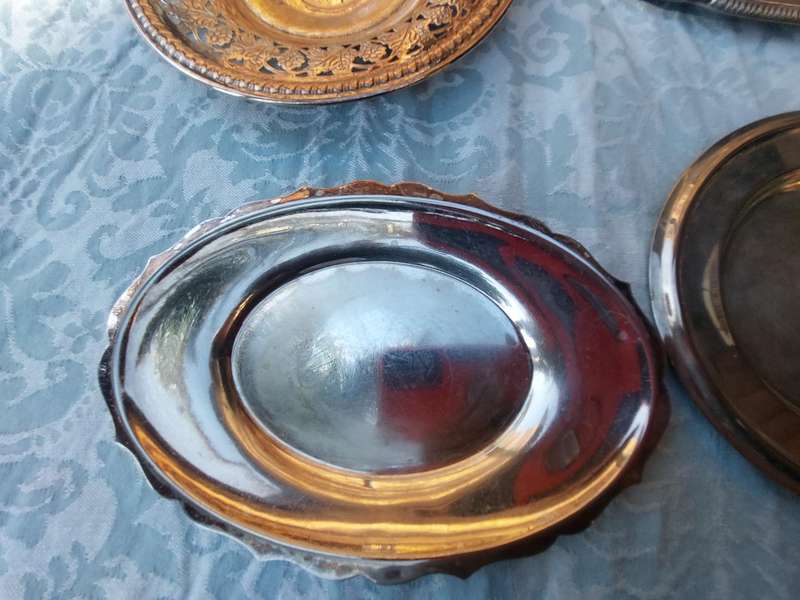 A COLLECTION OF SILVER PLATED SERVING TRAYS SOLD AS IS