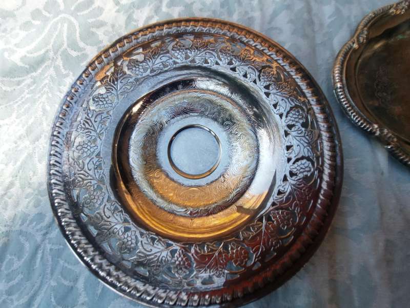 A COLLECTION OF SILVER PLATED SERVING TRAYS SOLD AS IS