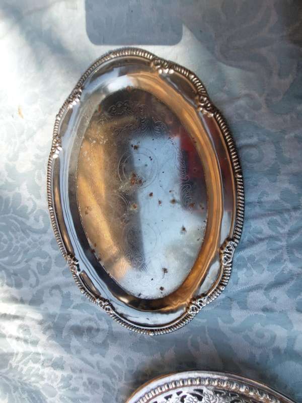 A COLLECTION OF SILVER PLATED SERVING TRAYS SOLD AS IS