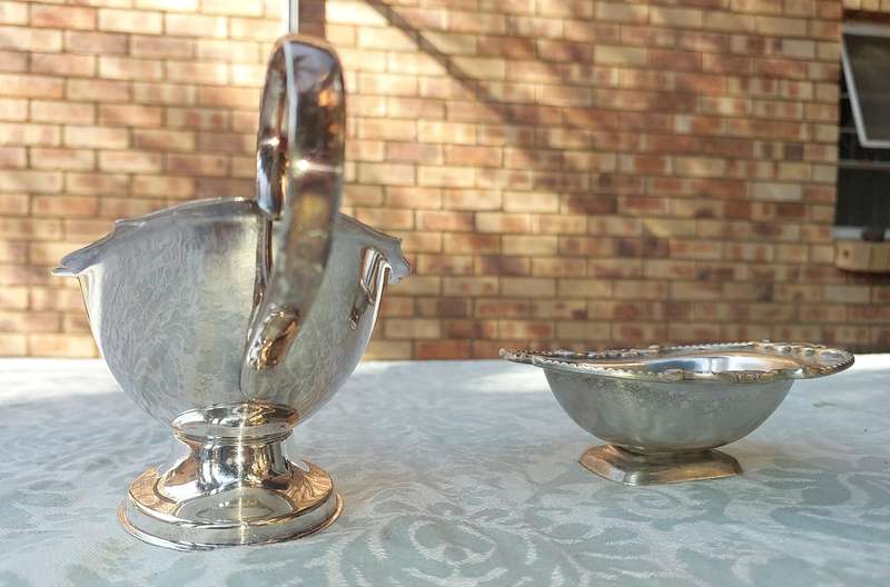 TWO VINTAGE UTENSILS A SAUCE BOAT AND A BUTTER DISH SOLD AS IS