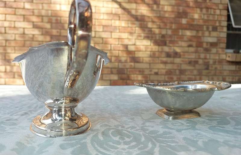 TWO VINTAGE UTENSILS A SAUCE BOAT AND A BUTTER DISH SOLD AS IS